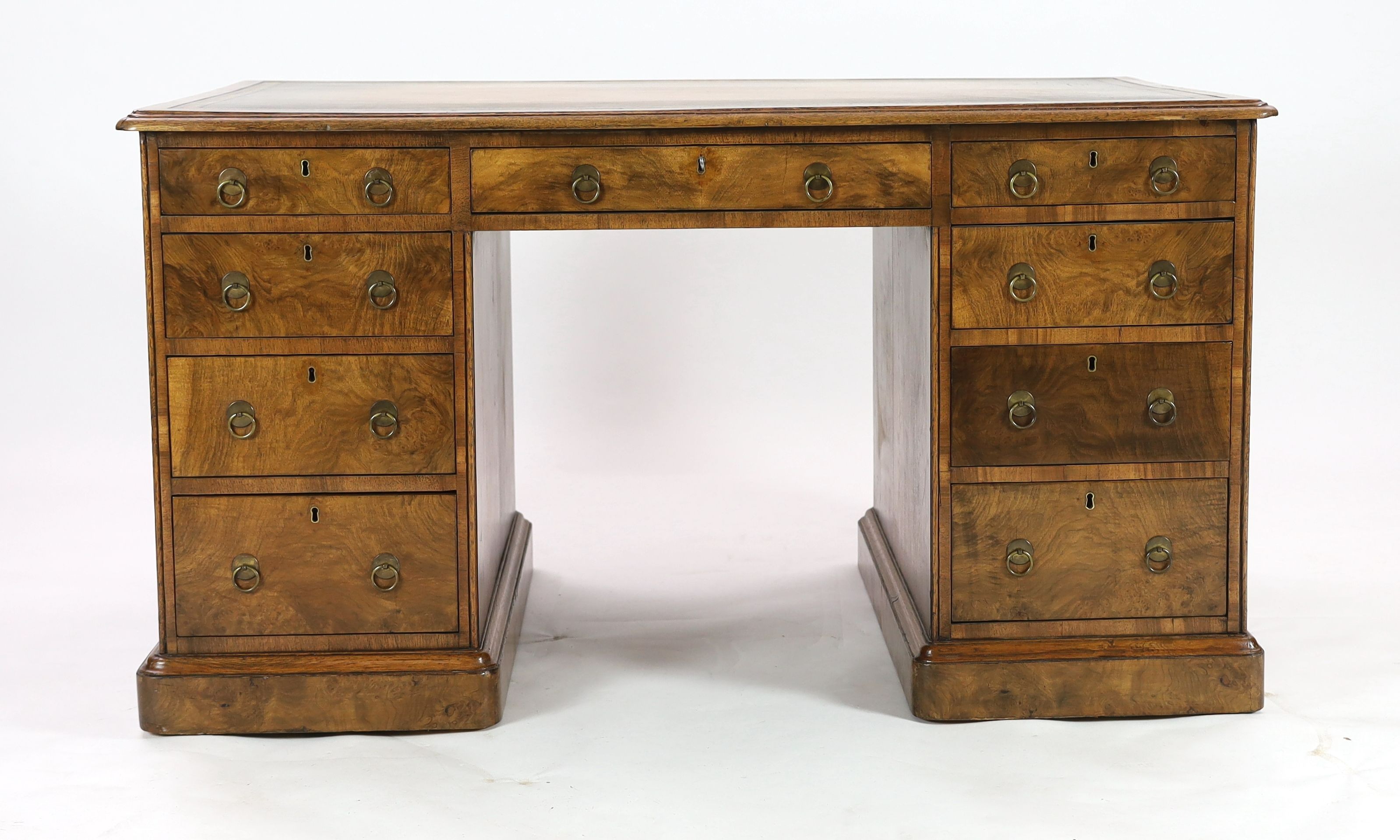A late Victorian Gillow & Co. walnut pedestal desk, W.137cm D.85cm H.76cm